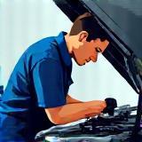 Mechanic working diligently on a BMW engine bay