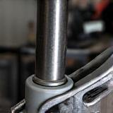 Suspension control arm bushings being pressed